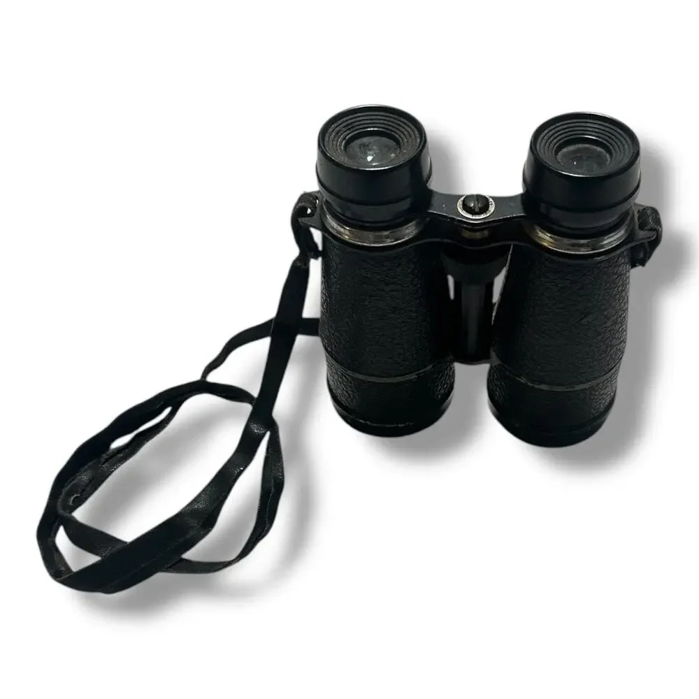 Compact Black Binoculars with Textured Grip and Central Hinge